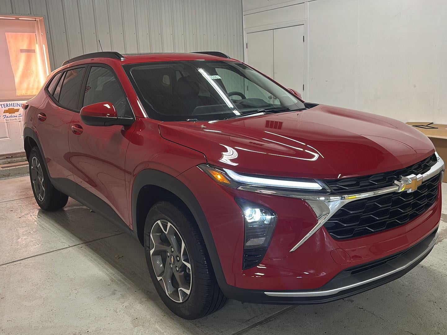 2026 Chevrolet Trax LT in Apex Red — front three-quarter view